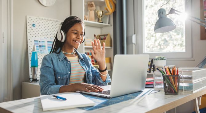 Image of girl at laptop learning online