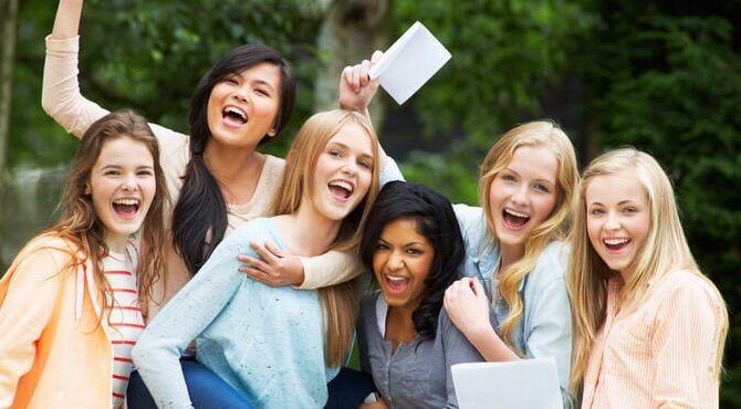 young students celebrating IB results