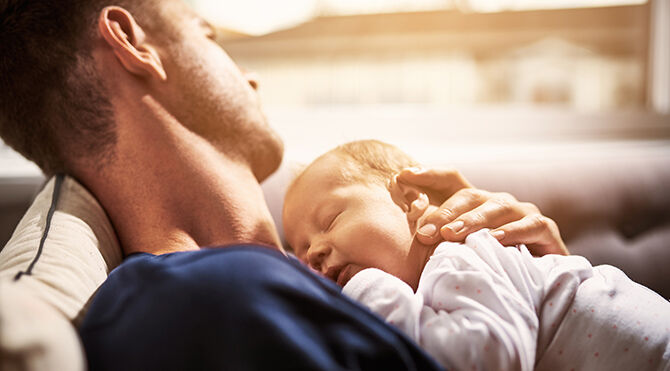 Male holding young child