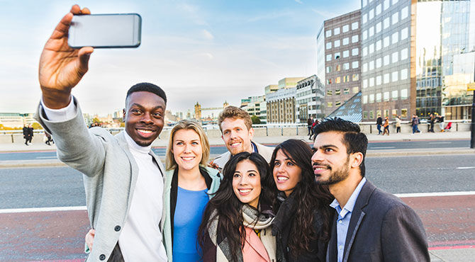 Group of Generation Y and Z travellers taking selfie