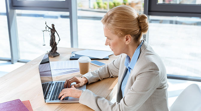 Female lawyer using a laptop