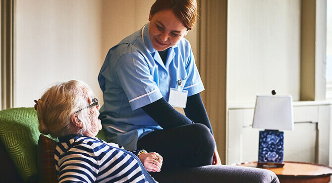 NHS careworker looking after elderly woman