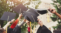 Graduates holding hats