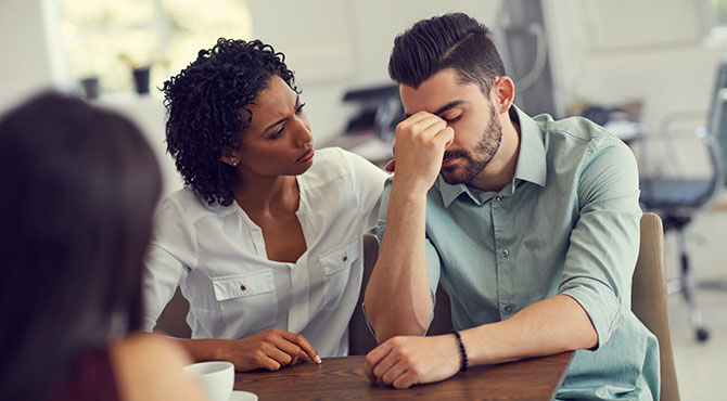 Two coworkers talking about mental health