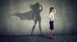 An image of a businesswoman with her shadow showing that she is Superwoman