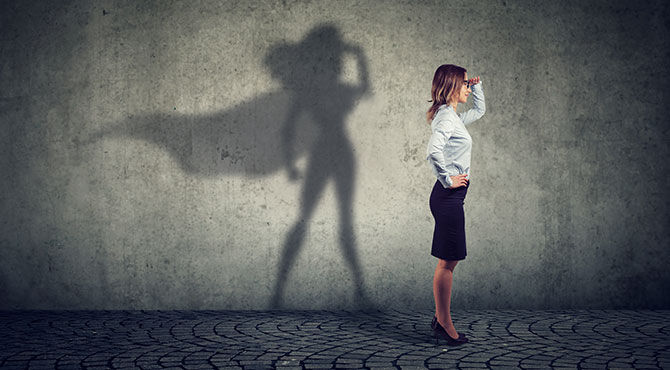 An image of a businesswoman with her shadow showing that she is Superwoman