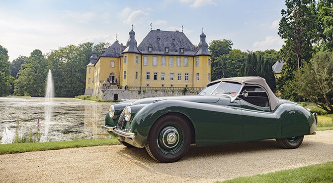 Jaguar in front of a stately home