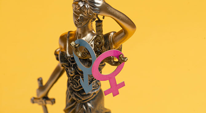 Male and female symbols on lady justice