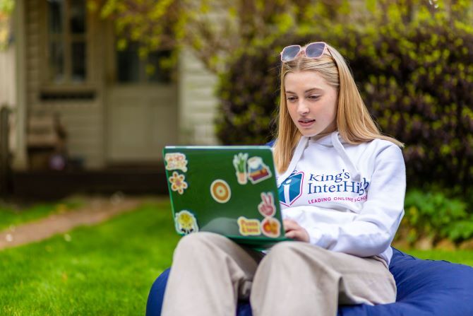 Image of King's InterHigh student studying outside