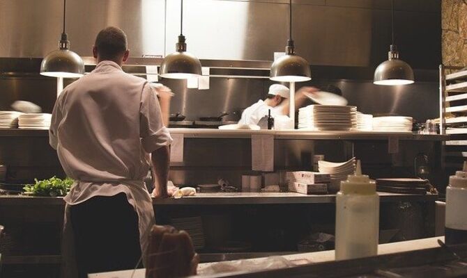 Chefs working in kitchen