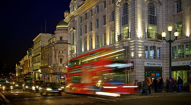 Image of London bus driving through the city to illustrate an article about London defying the Brexit effect