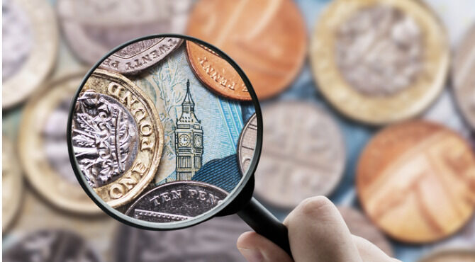Maginifying glass over Big Ben on 20 pound note