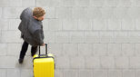 man-with-yellow-suitcase