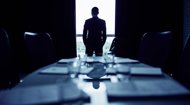 Manager standing in meeting room