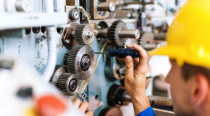 Man working on industrial machines