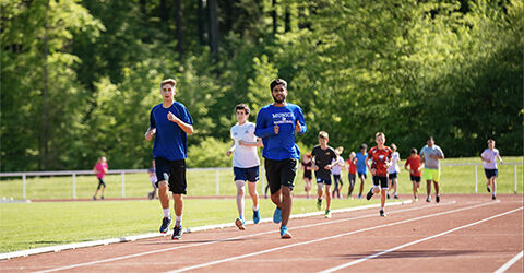Munich International School students running on the track