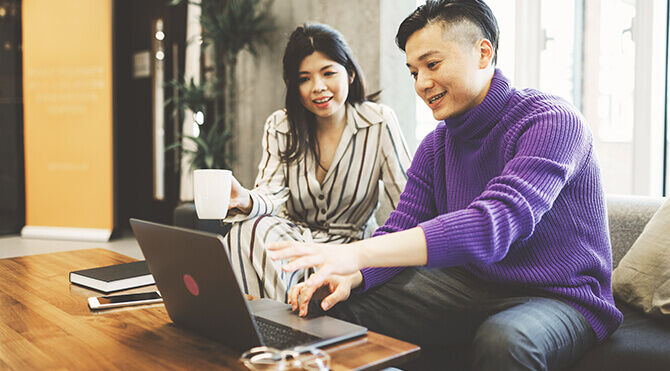 Young investors on laptop