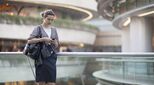 Women checks phone in urban centre