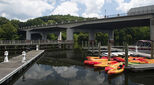 Occoquan, USA - August 10, 2017. Marina in Occoquan, Virginia, with bridge over river. Occoquan is a historic town located in Prince William County, Virginia, by Occoquan River..