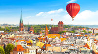 Aerial panoramic view of historical buildings and roofs in Polish medieval town Torun