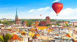 Aerial panoramic view of historical buildings and roofs in Polish medieval town Torun