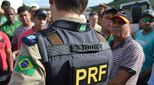 Image of activists in Brazil and local police officer in conversation