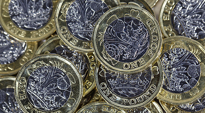 Photo of pound coins illustrating an article about the jobs with the highest salaries in the UK