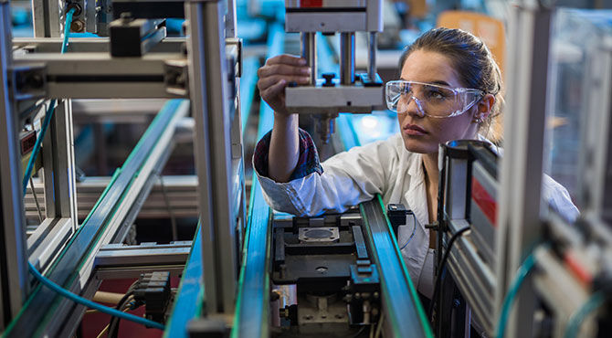 A woman scientist at work in the lab illustrates an article about UK R&D investment and tax credits