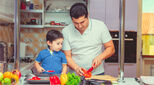 Father and son preparing food