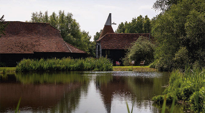 Relocate Global headquarters, featuring an oast building and pond