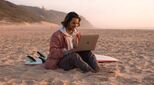KIH-student-on-beach-surfboard