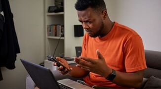 stock-image-man-phone-laptop