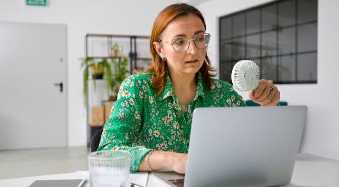 woman-fan-laptop-stock-image