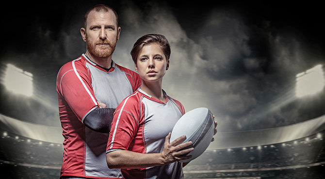 Man and woman with rugby bal