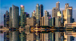 Singapore skyline reflected in strait