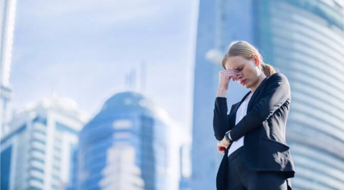 Stressed business person in shadow of office