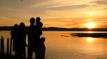 Image of sunset and family in silhouette