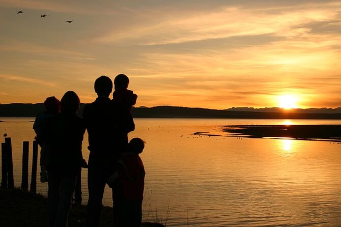 Image of sunset and family in silhouette