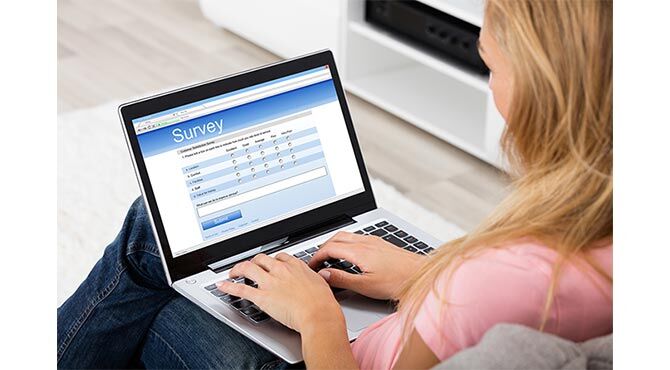 Fill out Permit's Foundation's Brexit survey - image of woman on laptop filling in a survey