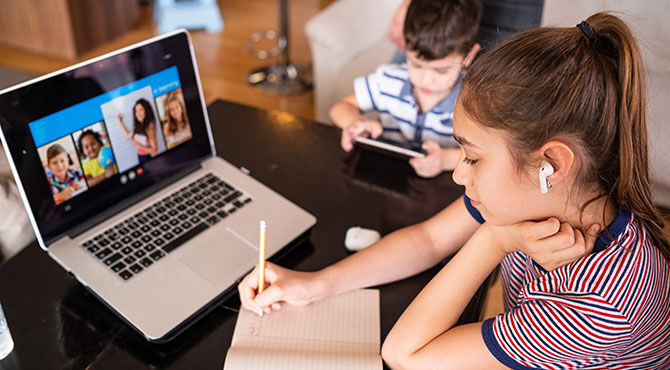 Teacher instructs students via video camera