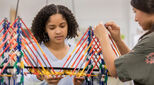 Teenagers working in classroom on engineering project