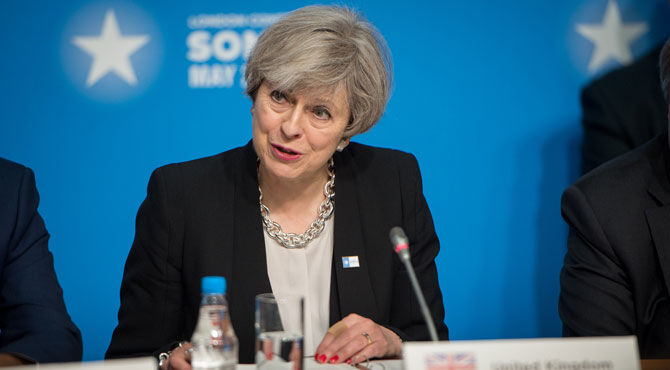 A photo of Prime Minister Theresa May illustrates an article about the Tory manifesto which promises punitive cuts