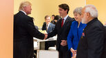 Photograph of Justin Trudeau and Theresa May meeting with Donald Trump