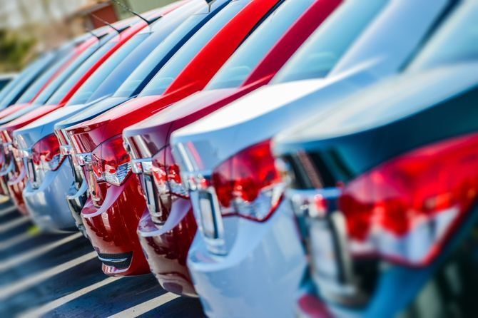 Photograph of cars in a row illustrating an article about the UK motor industry receiving £100 million from France