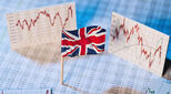 Union Jack flag with financial charts