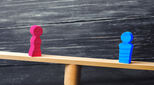 Image of balance between pink and blue pegs