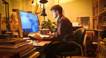 Image of person working from home in evening