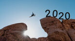 Image of person jumping between two rock outcrops