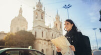 Image of woman with a map in Portugal