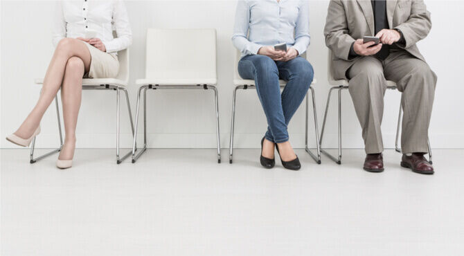 Image of an empty chair among queue